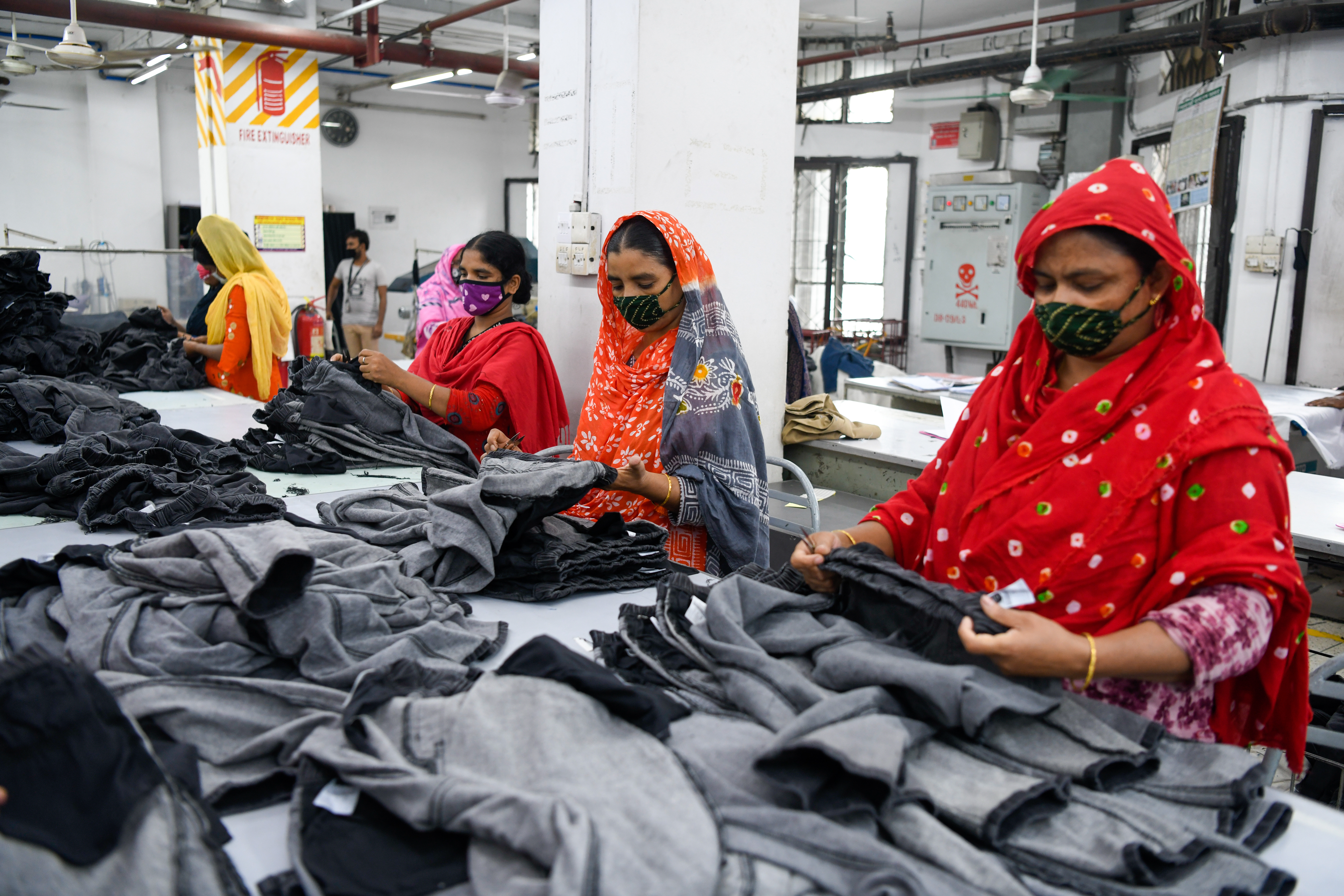 Garment workers sorting finished pieces